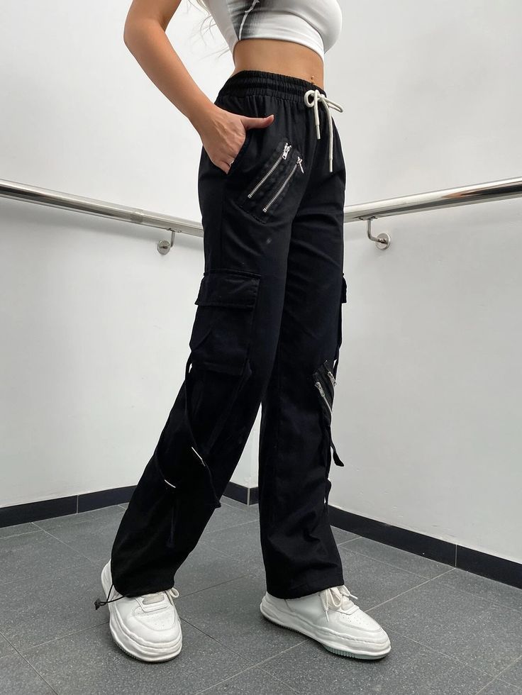 Make a fashion statement with these Zipper Detail Drawstring Cargo Pants. These pants feature a drawstring waist for a comfortable fit and zipper details that add a touch of edgy style. The combination of functionality and fashion makes them a versatile choice for various occasions. Whether you're going for a casual or street-style look, these zipper detail drawstring cargo pants will elevate your outfit. Specifications: Style: Casual Type: Cargo Pants Details: Drawstring, Pocket, Zipper Waist L Black Cargo Pants With Zip Fly For Fall, Trendy Black Pants With Zip Fly, Utility Pants With Zipper Closure For Fall, Trendy Black Bottoms With Side Zipper, Trendy Sweatpants With Drawstring For Streetwear, Casual Baggy Pants With Zipper Closure, Casual Baggy Pants With Zipper, Trendy Black Bottoms With Zip Fly, Trendy Drawstring Sweatpants For Streetwear