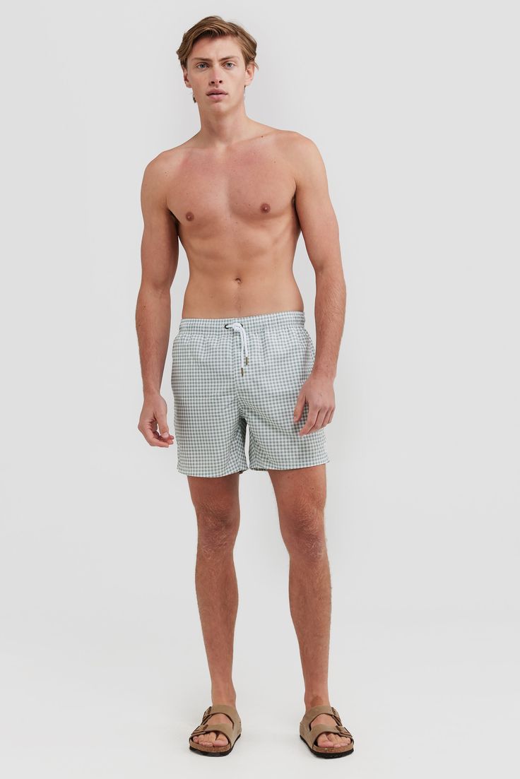 The Horrocks Sage Swim Shorts are the perfect addition to your summer wardrobe. Made from 100% Recycled Polyester, these mid-length shorts are quick-drying and lightweight. An elastic waistband with a drawstring provides an adjustable fit, while internal fine mesh briefs provide extra comfort. Pair with one of our T-shirts to make the perfect summer look. Quick drying, mid-length swim shorts 100% Recycled Polyester Internal fine mesh briefs Elastic waistband with drawstring Two side pockets with rear button up pocket Designed in Australia. Made in China Sporty Summer Boxer Briefs With Short Inseam, Short Swim Trunks For Beach Season Loungewear, Summer Swim Trunks For Loungewear, Summer Poolside Shorts With Short Inseam, Nylon Bottoms For Summer Vacation, Summer Vacation Nylon Bottoms, Summer Loungewear Athletic Shorts With Short Inseam, Relaxed Fit Short Length Swim Trunks, Beachwear Bottoms For Warm Weather