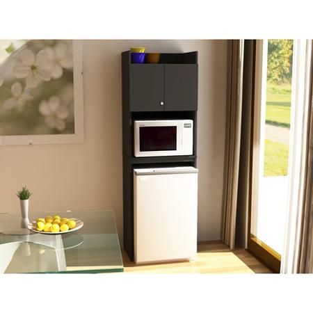 a microwave oven sitting on top of a counter next to a glass table with food