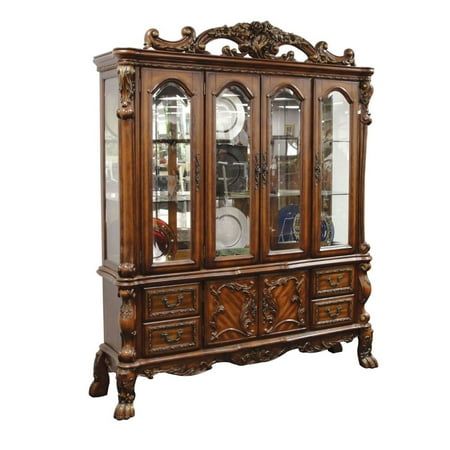 an old fashioned china cabinet with glass doors