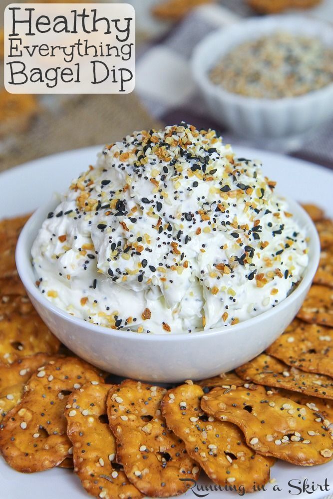 a white plate topped with crackers and dip