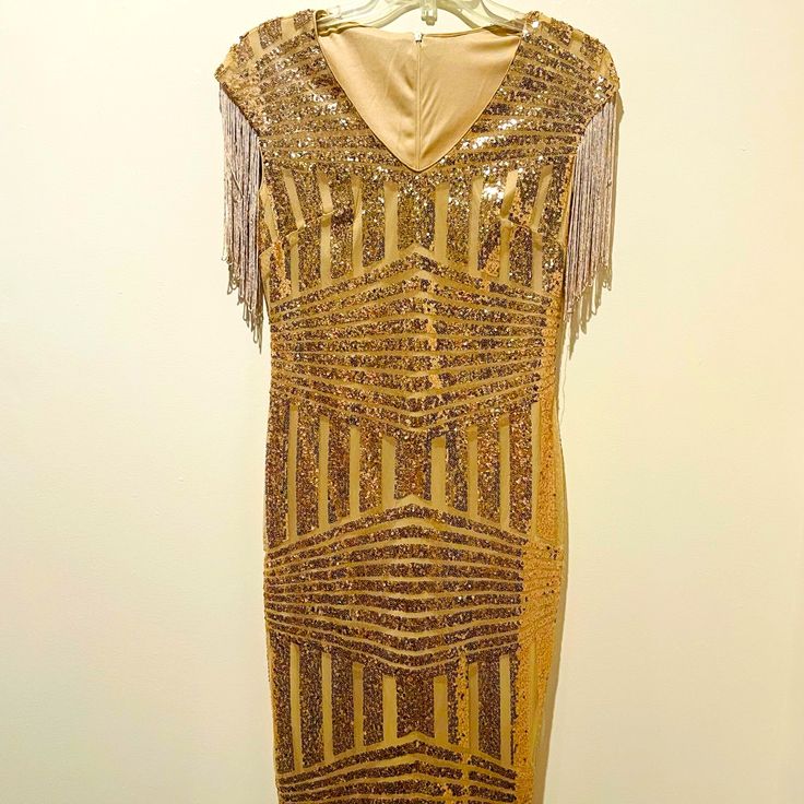 Women's Gold Designer Short Party Dress (Size-M) In Brand New Condition Fast Shipping Check Out My Other Listings, Bundle & Save Happy To Answer Any Questions! Don't Like My Price? Open To Reasonable Offers :) Thank You For Browsing My Closet! <3 Fitted V-neck Flapper Dress For Party, Glamorous Flapper Dress For Holiday Night Out, Glamorous Holiday Flapper Dress For Night Out, Elegant V-neck Flapper Dress For Party, Sleeveless Flapper Dress For Holiday Party, Glamorous V-neck Flapper Dress For Evening, Glamorous Holiday Flapper Dress For Party, Glamorous Holiday Party Flapper Dress, V-neck Flapper Dress For Party Season