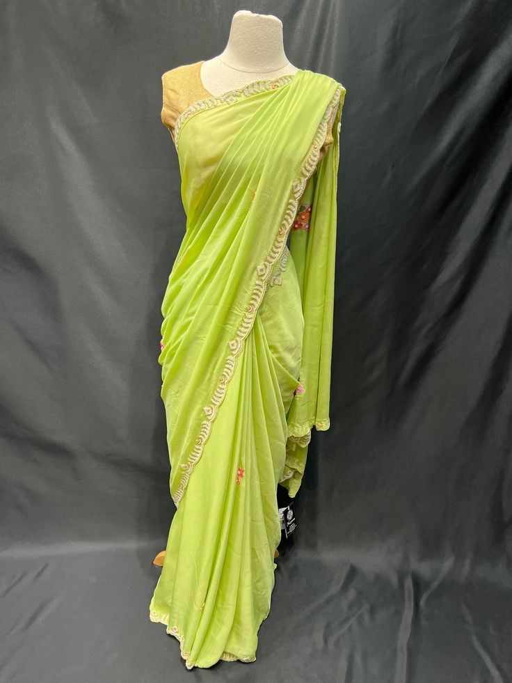 Elevate your style with our Party Wear Saree D-230! Adorned with exquisite pearl work, this saree will add a touch of elegance to any special occasion. Stand out in a crowd and feel confident in this stunning piece. Make a statement, get your Party Wear Saree D-230 today! Pista Green Pre-draped Saree With Zari Work For Diwali, Festive Pre-draped Saree With Dabka Work For Diwali, Traditional Drape Pre-draped Saree With Dabka Work, Bollywood Style Dori Work Pre-draped Saree In Dola Silk, Chinon Pre-draped Saree With Dabka Work, Festive Pista Green Pre-draped Saree For Party, Pista Green Georgette Pre-draped Saree With Dupatta, Eid Pista Green Dola Silk Pre-draped Saree, Designer Chinon Pre-draped Saree For Diwali