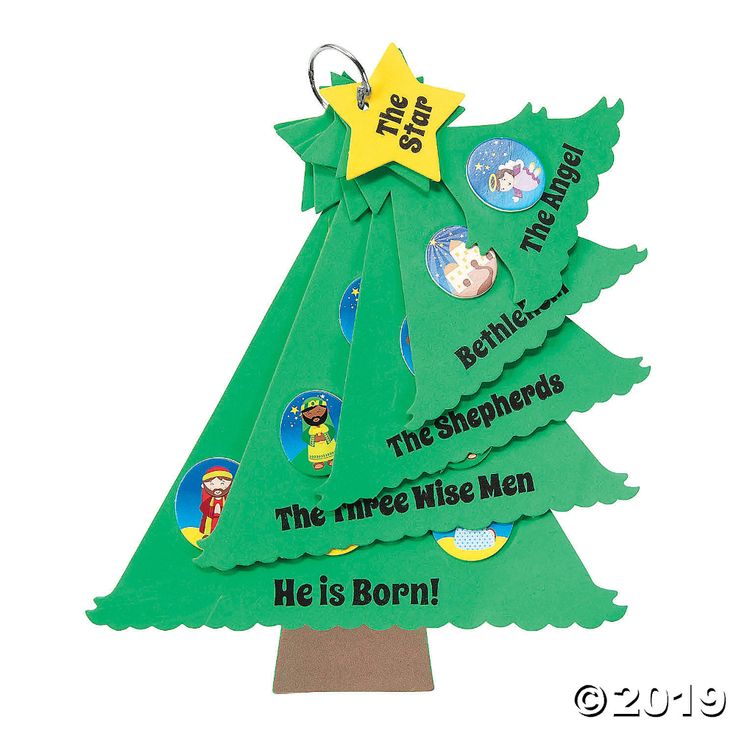 a cardboard christmas tree with the words he is born on it