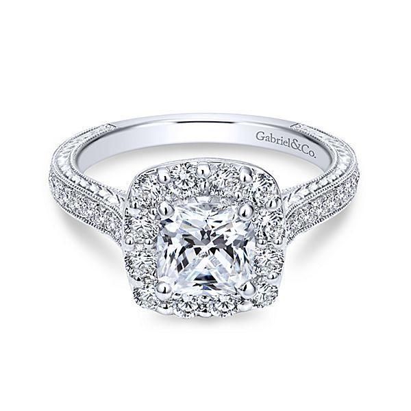 a cushion cut diamond engagement ring with halos