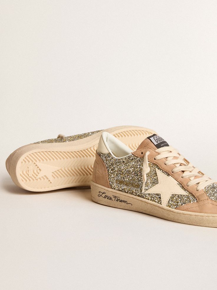 Dreaming of the Eighties. Our Ball Star sneakers have an American college vibe caught between a hoop shot and a skateboard ride. This model with a platinum glitter upper features a cream leather star and heel tab. The beige nubuck inserts and toe, contrast black lettering on the foxing and cream laces add the finishing touch: beautiful things that never go out of fashion. The Eighties, Lace Socks, Star Sneakers, Cream Lace, Golden Goose, Gift Collections, Beautiful Things, Small Gifts, Mini Bag