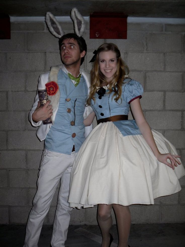 a man and woman dressed up as peter the rabbit and alice from disney's wonderland