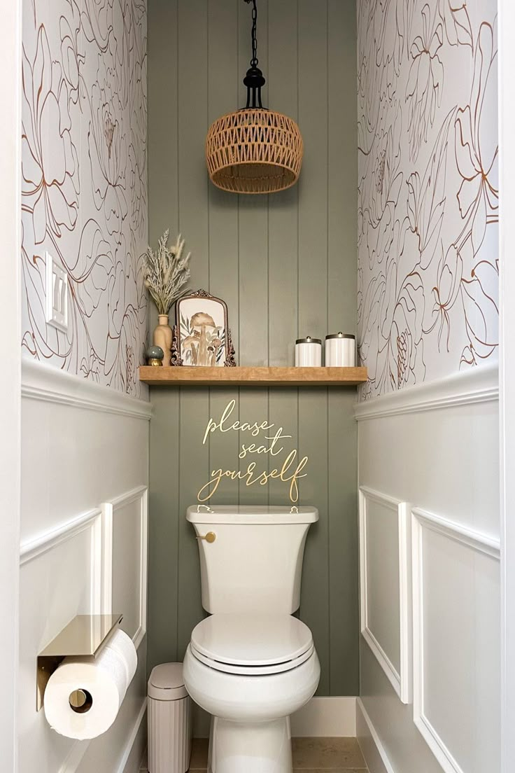 a white toilet sitting inside of a bathroom next to a shelf filled with rolls of toilet paper