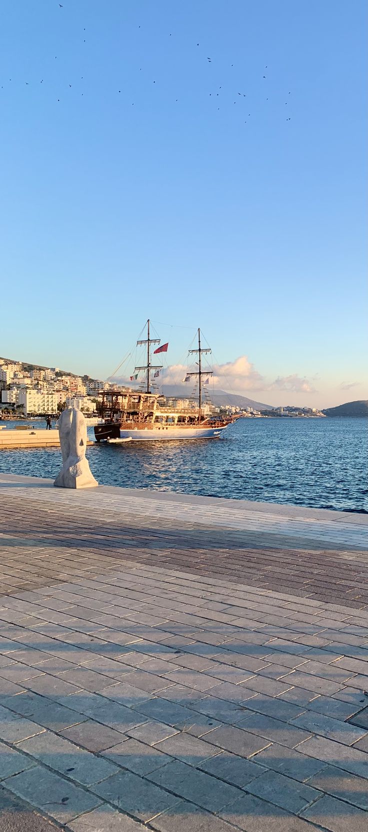 there is a statue that looks like a ship in the water