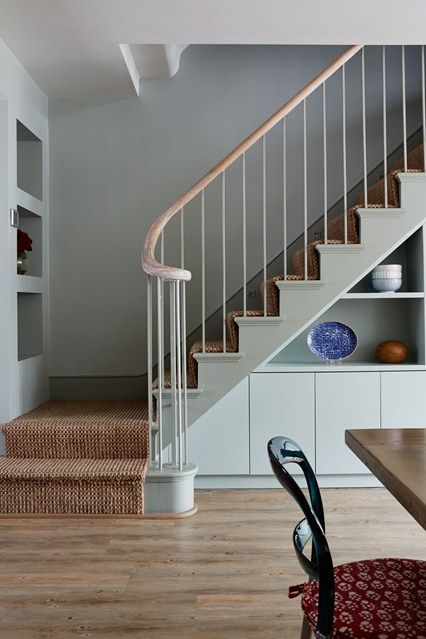 a room with some stairs and a table