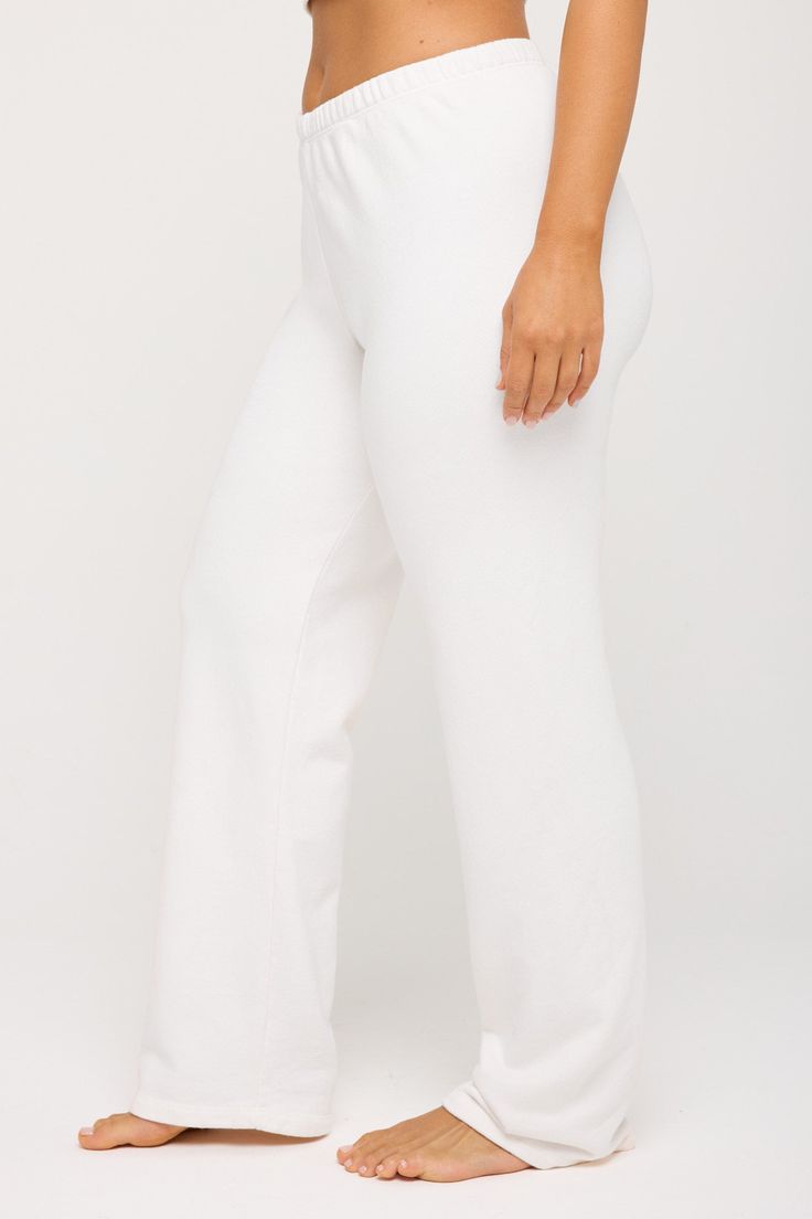 Shoot it straight. A relaxed fit, full-length straight-leg pant designed with an encased elastic waistband. Made with a French Terry fabrication, it's the perfect blend of 75% cotton and 25% modal, creating an extra (extra) soft feel. | Joy Straight Leg Pant in White Full Length 4-way Stretch Pants For Loungewear, Straight Leg Sweatpants With Ribbed Waistband, Straight Leg Pull-on Sweatpants For Loungewear, Solid Straight Leg Sweatpants For Relaxation, White Athleisure Pants With Straight Hem, Chic Comfort Stretch Pants For Loungewear, Chic Straight Leg Yoga Pants With Elastic Waistband, Chic Straight Leg Sweatpants For Lounging, Loose Fit Wide Leg Pants With Straight Hem