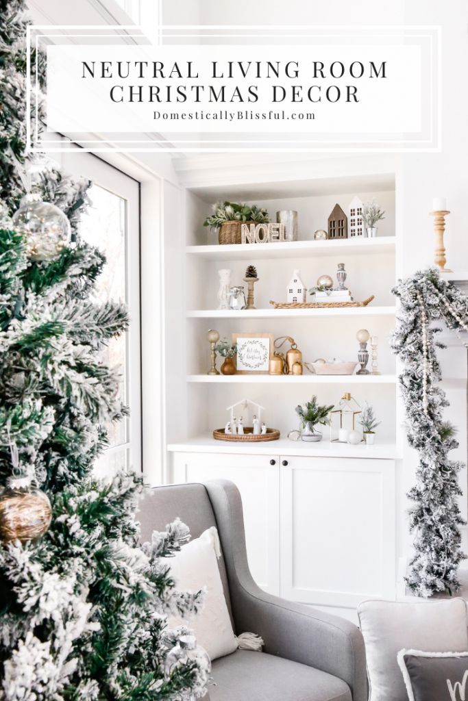 a living room decorated for christmas with white walls and shelves filled with holiday decorations, greenery and ornaments