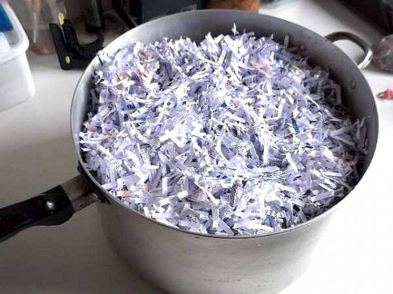 a pan filled with shredded paper sitting on top of a counter