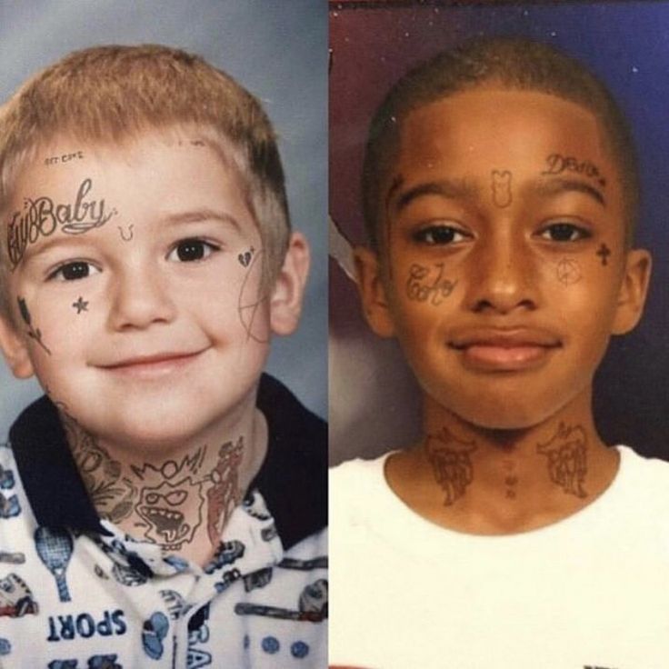 two boys with tattoos on their faces and one has his name written on the forehead