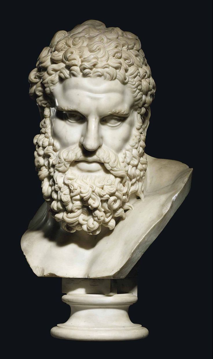 a white marble bust of a man with curly hair and beard