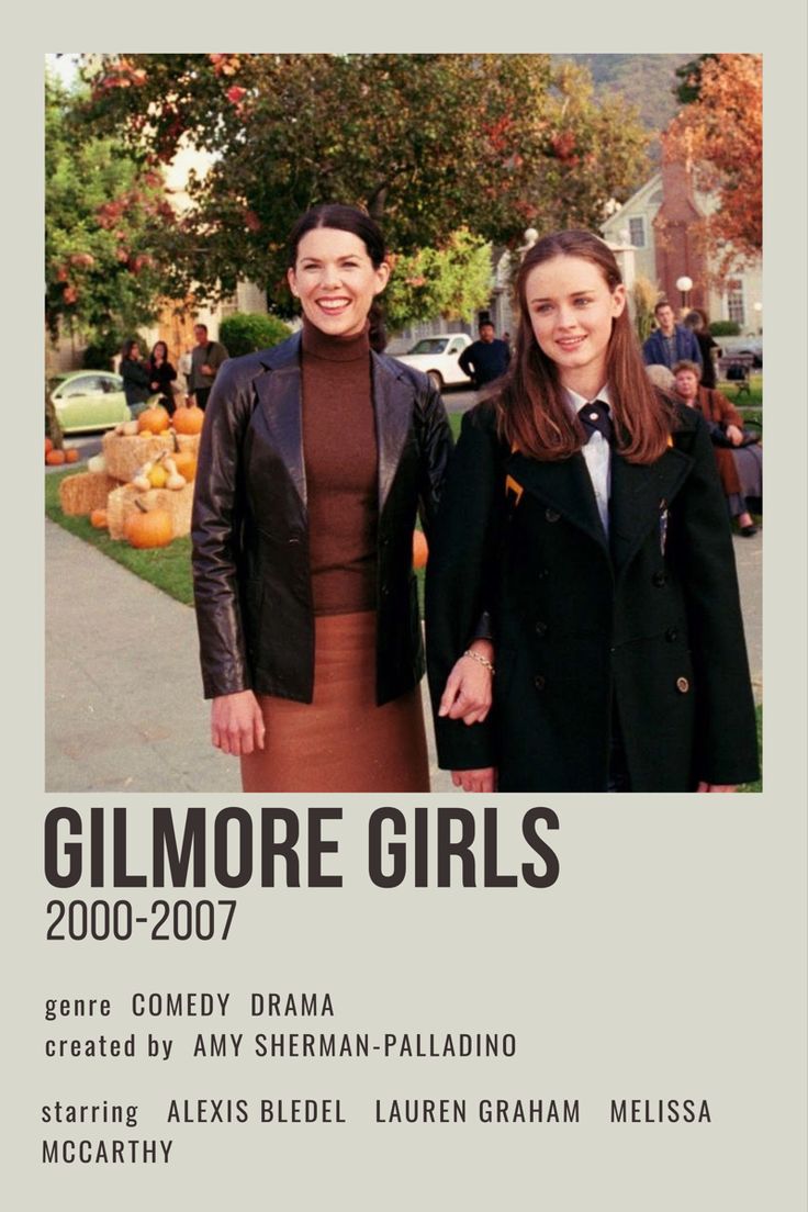 two women standing next to each other in front of a poster for the movie gilmore girls 2000