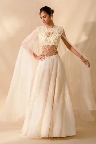 Shop for Richa Khemka Beige Organza Ebony Embellished Cape Lehenga Set for Women Online at Aza Fashions Pearl Cape, Cape Lehenga, Pearl Tassels, Flare Blouse, Lace Cape, Cape Designs, Asian Bridal Dresses, Pearl Embroidery, Embellished Skirt