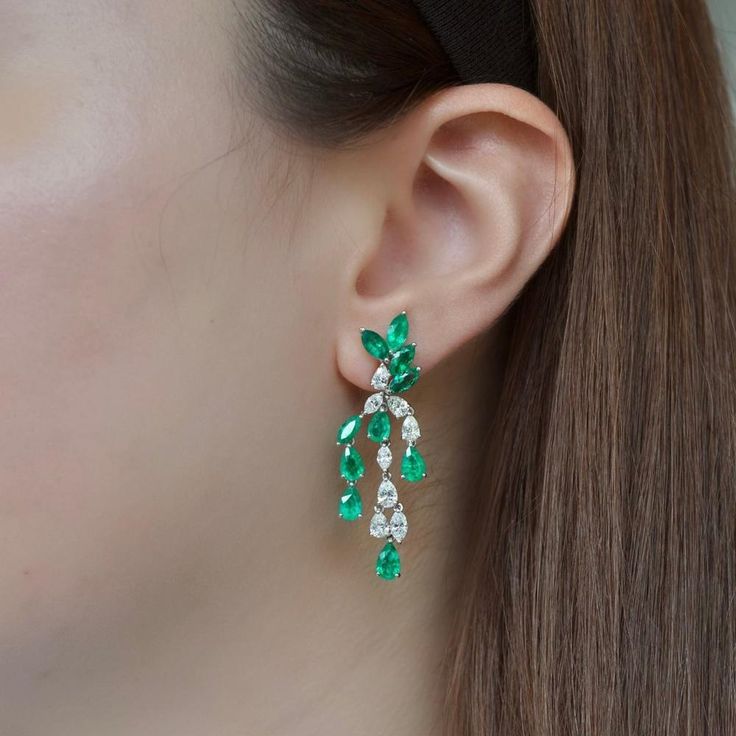 Celebrate the art of fine craftsmanship in the exquisite Jewels of Desire Laurel Earrings by Ruchi New York. These earrings boast clean lines that beautifully showcase the elegance of oval Colombian emeralds and marquise diamonds. With 1.33 carats of dazzling diamonds and 6.24 carats of mesmerizing Colombian emeralds, these earrings are a testament to luxurious sophistication.From Ruchi New York's High Jewelry collection, the Jewels of Desire series captures the essence of opulence and style. Inspired by the breathtaking landscapes of Italy's Lake Como, each piece radiates with the vibrant hues of emeralds and the brilliance of diamonds. These earrings are not just accessories; they're expressions of refined taste and timeless beauty.Adorn yourself with the allure of these Laurel Earrings Elegant Green Diamond Earrings, Elegant Emerald Diamond Earrings For Anniversary, Fine Jewelry Marquise Earrings For Evening, Elegant Hand Set Pear-shaped Earrings, Elegant Emerald Drop Jewelry, Elegant Gemstone Chandelier Earrings For Wedding, Elegant Drop Emerald Jewelry, Elegant Hand-set Pear-shaped Earrings, Elegant Marquise Earrings For Formal Occasions