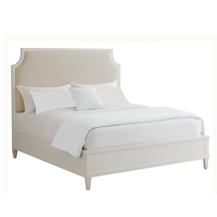 a bed with white linens and pillows on it's headboard, in front of a white background