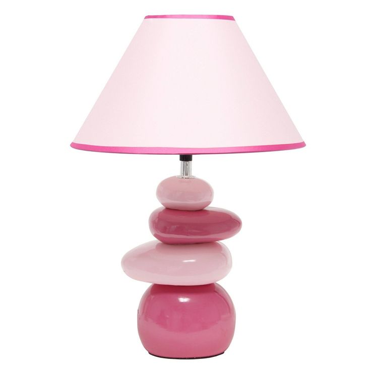 a pink lamp sitting on top of a table