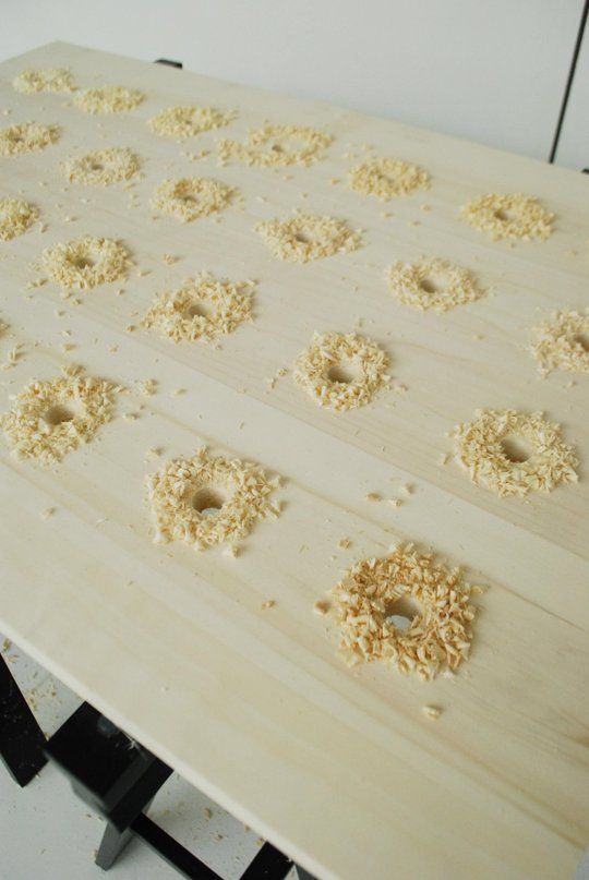 doughnut holes are arranged on a wooden board