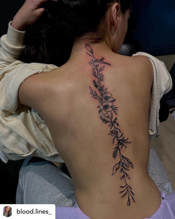 a woman with a tattoo on her back