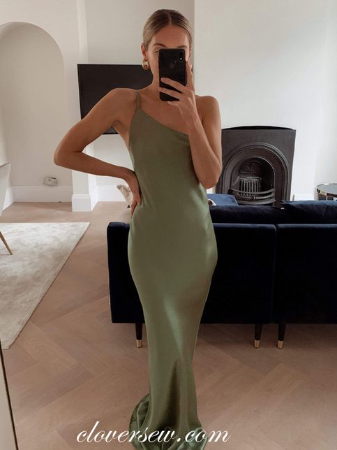 a woman taking a selfie in a green dress