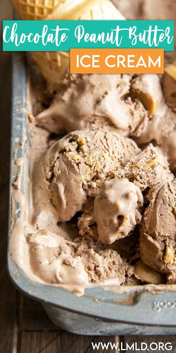 chocolate peanut butter ice cream in a blue container with two scoops and an orange peel