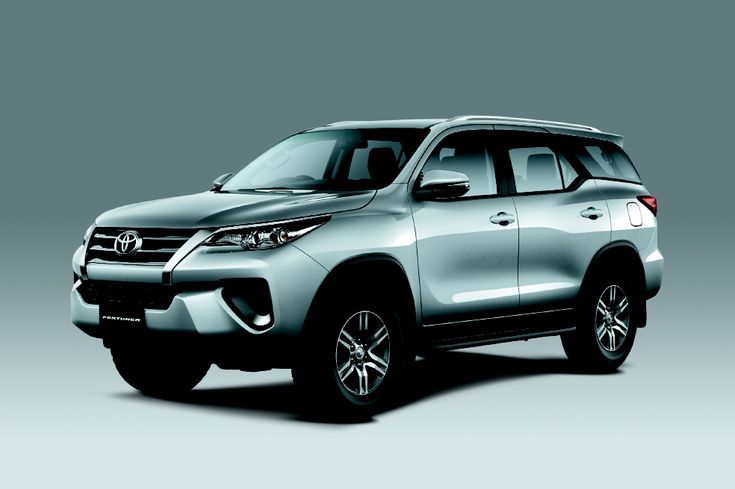 a silver suv is shown on a gray background