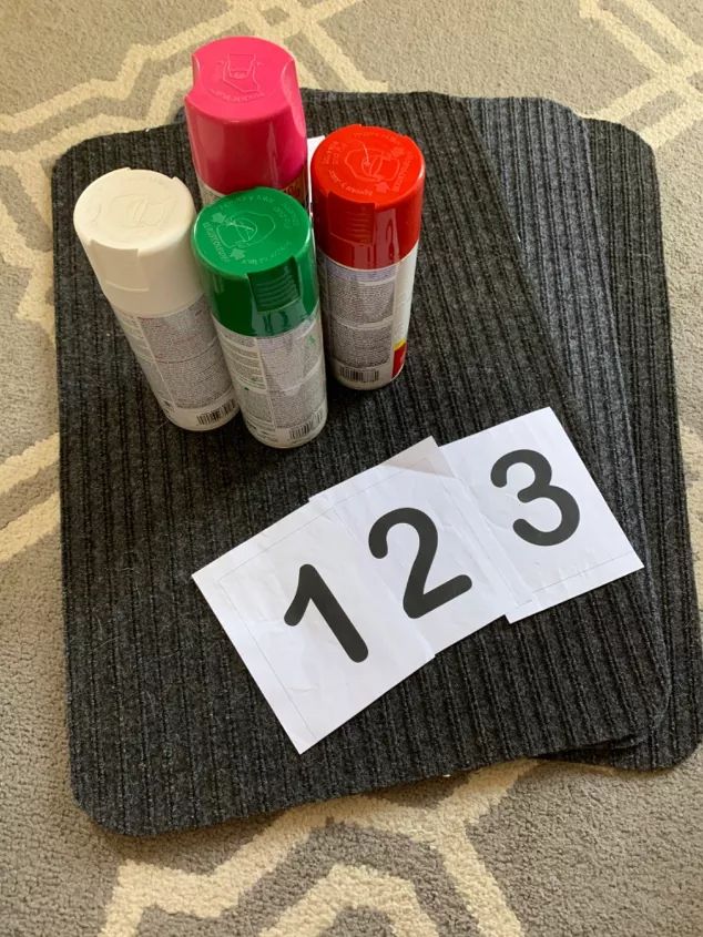 the numbers are placed next to each other on top of a placemat with markers