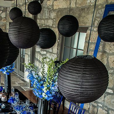 a dining room table with blue and black decorations