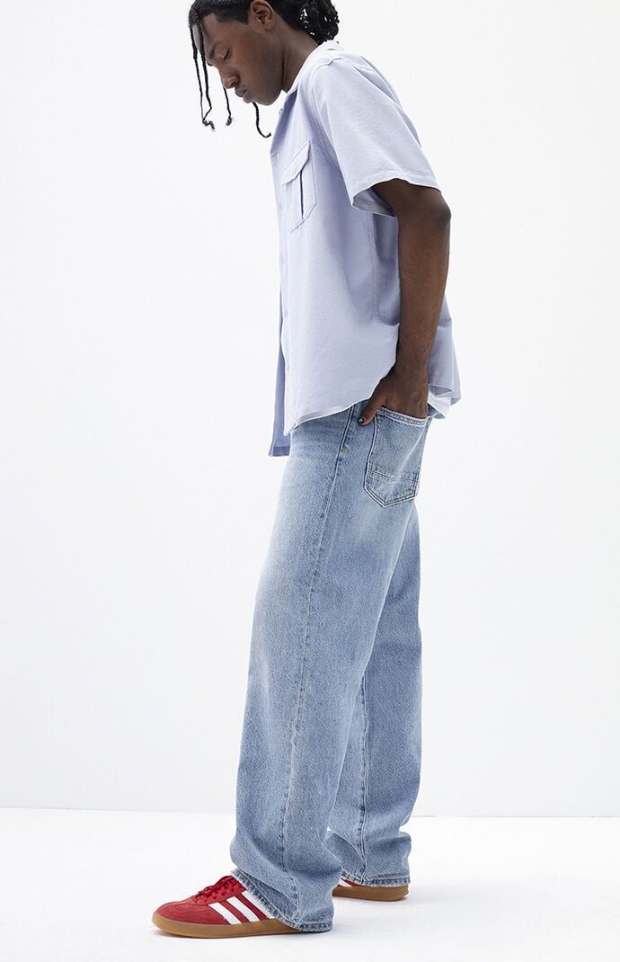 The PacSun Medium Indigo Baggy Jeans offer a classic relaxed fit with a wide leg and mid-rise design. Featuring a baggy fit from thigh through knee and an oversized wide leg opening, these jeans are completed with a zip fly closure, five-pocket body, and clean finish, making them a timeless choice for casual comfort and style.Model is wearing a size 32Model Measurements: 6'1” Height, 31” Waist, 32” Inseam PacSun Mens Medium Indigo Baggy Jeans - Blue size 28W 30L Trendy Pants Men, Blue Baggy Jeans Men’s Outfit, Shoes For Baggy Jeans, Light Wash Jeans Men, Men Baggy Jeans, Mens Baggy Jeans, Blue Jeans Outfit Men, Outfit Shuffles, Lau Lau