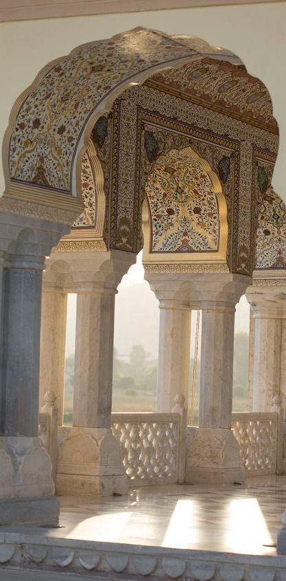 an intricately decorated building with columns and arches