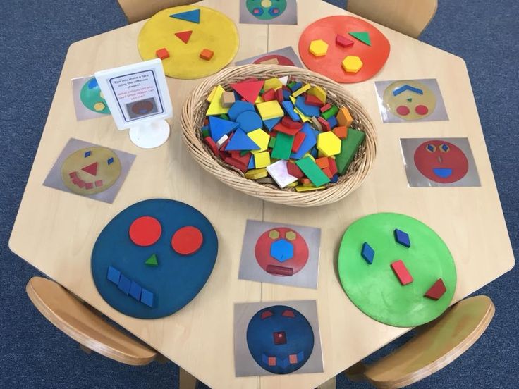 a wooden table topped with lots of different shapes and sizes