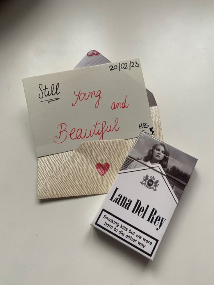 two envelopes with love notes attached to them