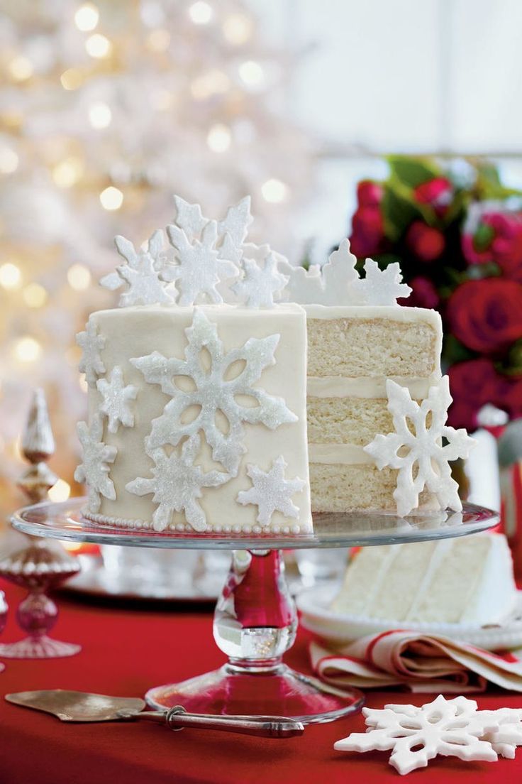 a white cake sitting on top of a red table