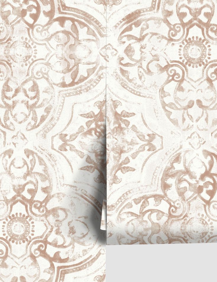 an old wallpaper pattern with brown and white designs on the side, in shades of beige