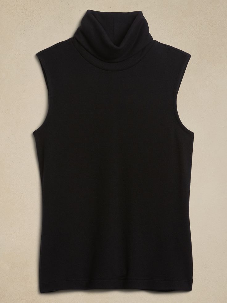 Winter Stretch Tank Top, Cozy Sleeveless Tops For Fall, Cozy Stretch Tops For Work, Stretch Turtleneck Tank Top For Winter, Winter Stretch Turtleneck Tank Top, Casual Fitted Turtleneck Tank Top, Solid Relaxed Fit Turtleneck Top, Chic Ribbed Turtleneck Tank Top, Fitted Cozy Sleeveless Sweater Vest