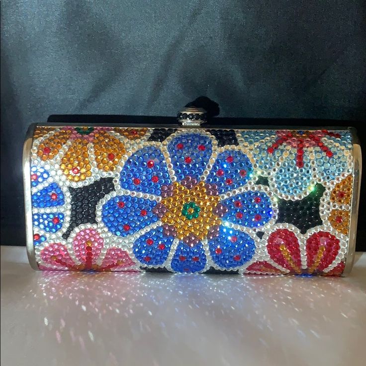 This Is A Brand New, Never Used, Evening Bag Fully Covered In Genuine Very Fine, Small Sized Swarovski Crystals From Austria! The Bag Is Covered In Both Sides With Spectacular Detail. It Is Also Lined In Genuine Leather. You Can Carry It As A Clutch But It Comes With A Long Detachable Metal Chain To Be Used As A Shoulder Strap So You Can Be Hands-Free! Handbag Comes With Extra Crystals. 5.75” Long * 2.75” H. Bag Is 3” Knob Included In Measurements 1.75” Wide Luxury Multicolor Rectangular Clutch, Multicolor Clutch Bag For Formal Occasions, Luxury Multicolor Evening Bag As Gift, Luxury Multicolor Handheld Clutch, Formal Multicolor Clutch Bag, Luxury Multicolor Pouch Clutch, Multicolor Clutch Shoulder Bag For Formal Occasions, Multicolor Handheld Bag For Formal Occasions, Formal Multicolor Clutch Shoulder Bag