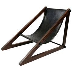 a wooden chair with black leather on it