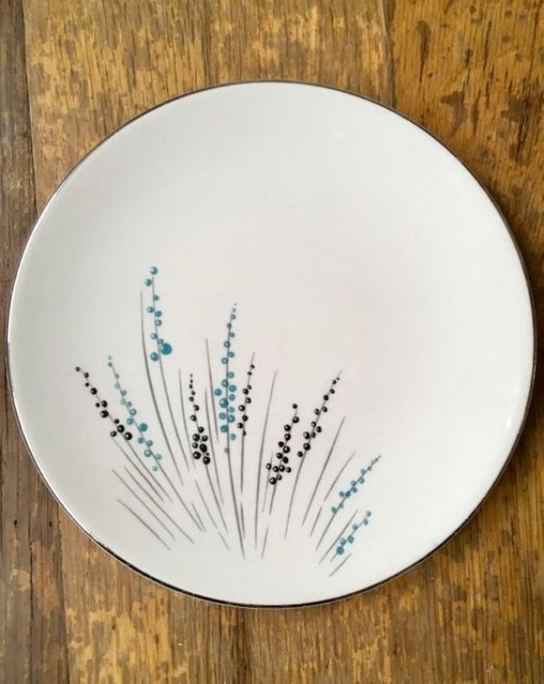 a white plate with blue flowers on it