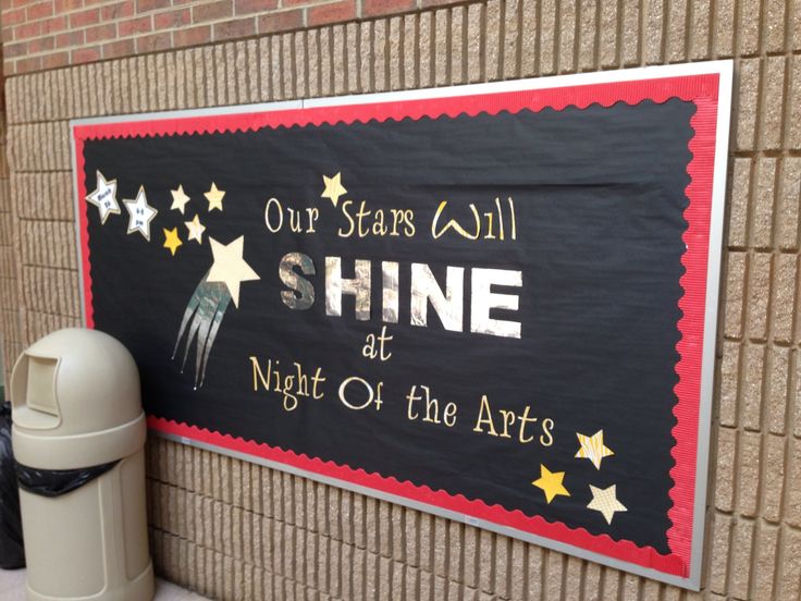 a sign on the side of a building that says shine at night of the arts