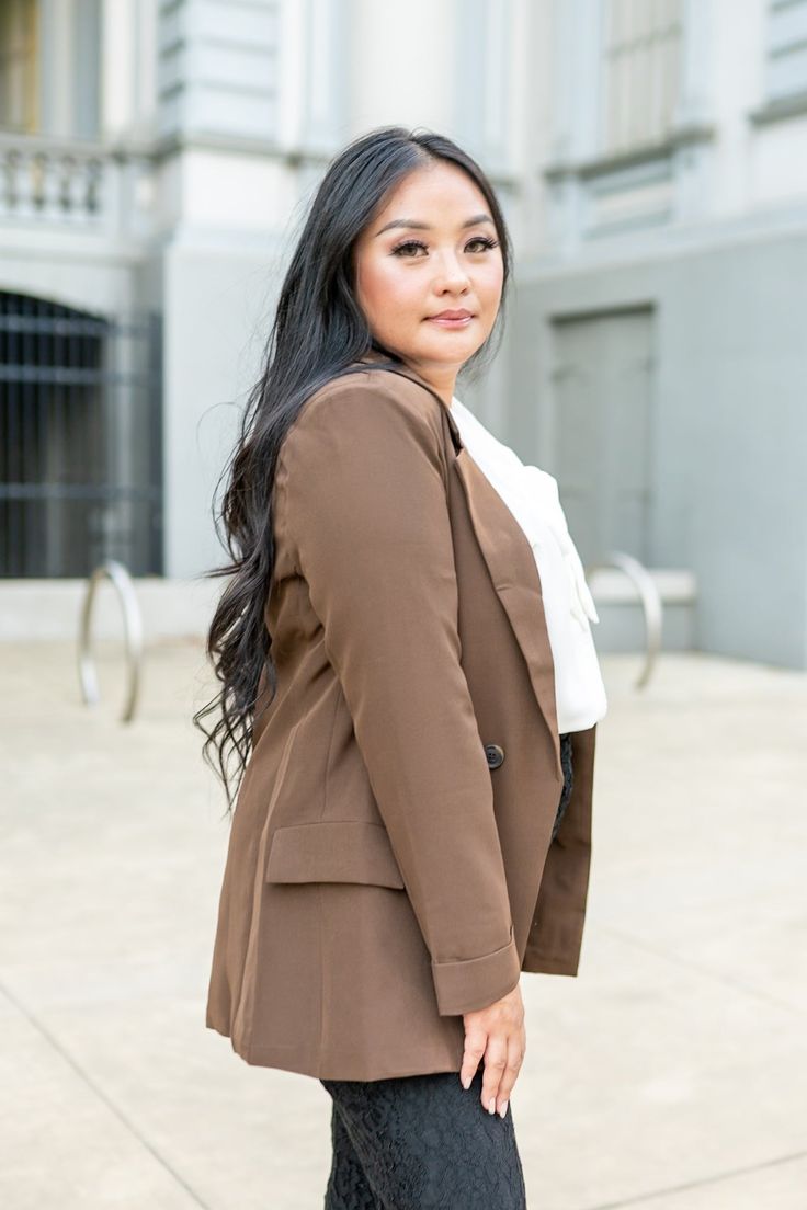 Stay ahead of the trends this fall with our stunning Walking Boldly Into Fall Blazer. Featuring a large collar and front button closure, this blazer exudes sophistication and style. The folded sleeves add a touch of elegance, while the padded shoulders provide a structured and flattering fit. With functional side pockets, this blazer seamlessly combines fashion and functionality. Color: Brown Fabric: 100% Polyester Runs slightly small, size up one Color may vary based on lighting Size chart Bust Folded Sleeves, Fall Blazer, Brown Fabric, Brand Ambassador, One Color, Dress Collection, Size Chart, Walking, Blazer