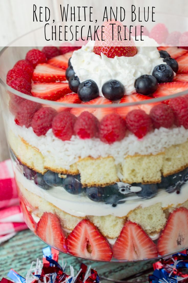 red, white and blue cheesecake trifle in a glass dish