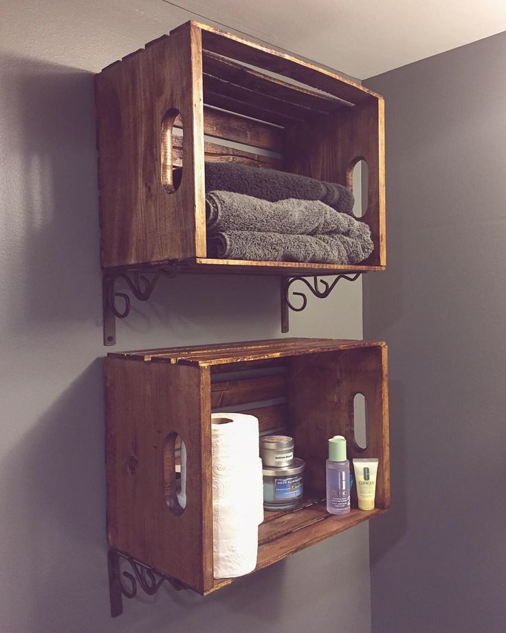 two wooden shelves with towels and toiletries on them