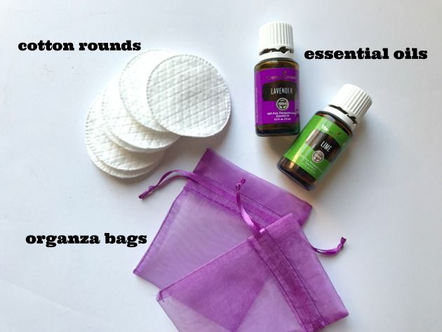 the contents of an essential oil bag, cotton rounds, essential oils and organza bags