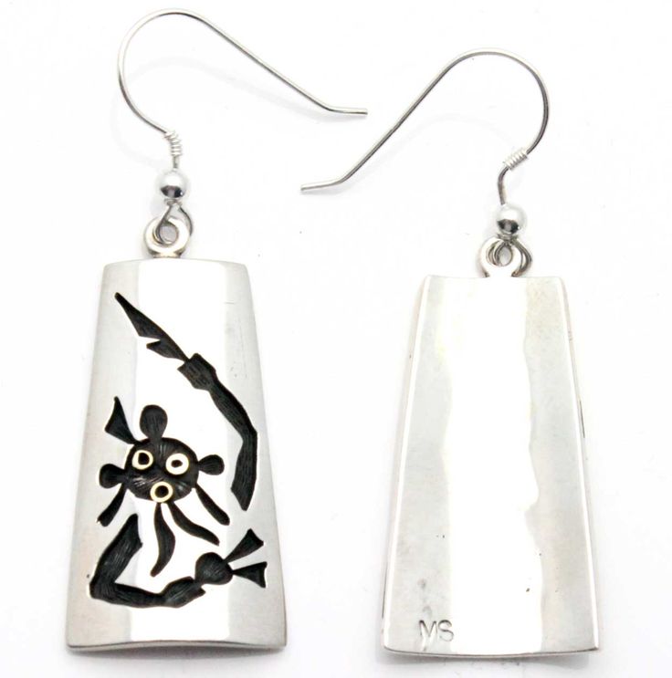 The Koyesmi symbol is featured on these beautifully detailed 1.25 Hopi Earrings. Silver Symbolic Engraved Earrings, Silver Engraved Symbolic Earrings, Symbolic Engraved Silver Earrings, Gold Sterling Silver Earrings With Artistic Design, Etched Sterling Silver Dangle Earrings, Symbolic Sterling Silver Pierced Earrings, Symbolic Drop Earrings With Ear Wire, Adjustable Drop Earrings With Artistic Design, Symbolic Drop Earrings