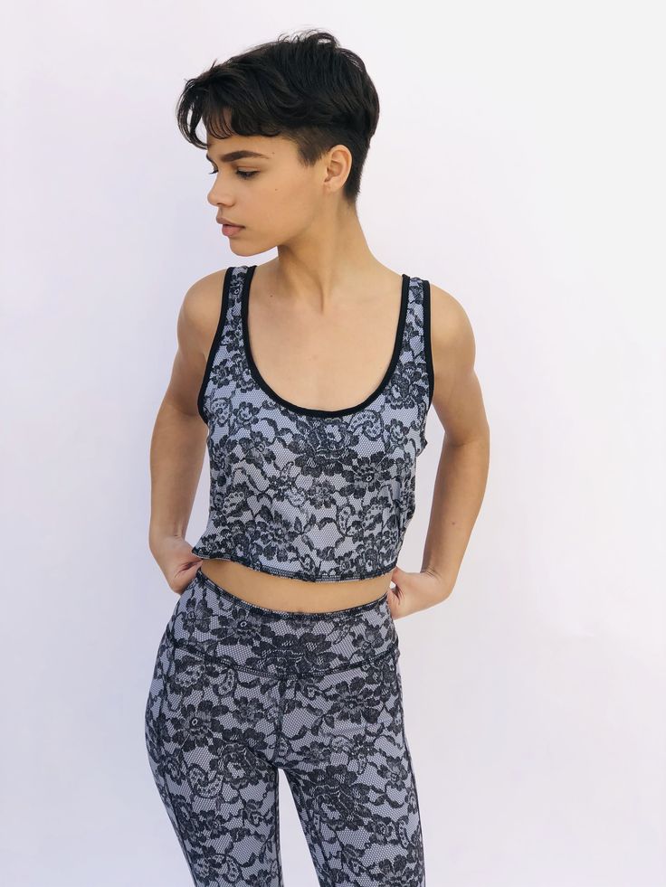 These comfortable and cute cropped bralets can be worn with the matching sports bra for added support. Paired with one of the many matching shorts, this top can be worn in the studio, as a bathing suit or out on the street. double sided with 2 different yet complimenting prints, made from recycled water bottles and spandex UV protection Black Crop Top Activewear With Built-in Bra, Black Activewear Crop Top With Built-in Bra, Casual Training Crop Top With Built-in Bra, Black Cropped Sports Bra For Summer, Sportswear Crop Top With Built-in Bra And Racerback, Black Sleeveless Sports Bra For Athleisure, Cropped Black Sports Bra For Summer, Sporty Black Tank Top For Yoga, Summer Cropped Black Sports Bra