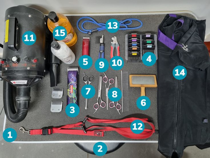 an assortment of tools laid out on top of a piece of gray fabric with blue numbers