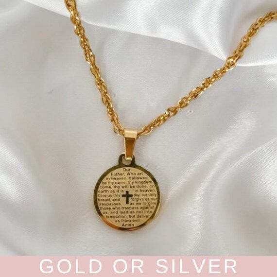 "Hold our Prayer Necklace close when you need that boost of faith and love. This beautiful piece features the Lord's Prayer to bring you comfort and provide protection.  ♡︎ 𝘼 𝙥𝙤𝙧𝙩𝙞𝙤𝙣 𝙤𝙛 𝙥𝙧𝙤𝙛𝙞𝙩𝙨 𝙛𝙧𝙤𝙢 𝙚𝙫𝙚𝙧𝙮 𝙤𝙧𝙙𝙚𝙧 𝙞𝙨 𝙙𝙤𝙣𝙖𝙩𝙚𝙙 𝙩𝙤 𝙒𝙤𝙢𝙚𝙣 𝙞𝙣 𝙣𝙚𝙚𝙙 ♡︎ ꕥ 𝗢𝗨𝗥 𝗝𝗘𝗪𝗘𝗟𝗥𝗬 𝗜𝗦 ꕥ * High Quality * Handmade * Waterproof  * 100% Lead & Nickel Free  * Won't tarnish or discolour * Hypoallergenic * Recyclable ꕥ 𝗠𝗔𝗧𝗘𝗥𝗜𝗔𝗟𝗦 ꕥ * 18K Gold Plated PVD Stainless Steel | Stainless Steel * 2.5mm Rope Chain * 3cm Pendant * Necklace includes 2\" extender ꕥ 𝗣𝗔𝗖𝗞𝗔𝗚𝗜𝗡𝗚 ꕥ * Every piece comes in their own little bag with a jewelry card. * 100% Recyclable Packaging ♺ ꕥ 𝗢𝗥𝗗𝗘𝗥 𝗧𝗜𝗠𝗘𝗦 ꕥ * Orders are shipped out within 1 Business Day ꕥ 𝗦𝗛𝗜𝗣𝗣 Christmas Gift Daughter, Lords Prayer, Faith Necklace, Lord's Prayer, The Lords Prayer, Recyclable Packaging, Jewelry Christmas, Jewelry Card, Christmas Gift Jewelry